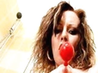 Crimson Haired Cutie Bj's A Lollipop And Stimulates Twat With A Baseball Bat